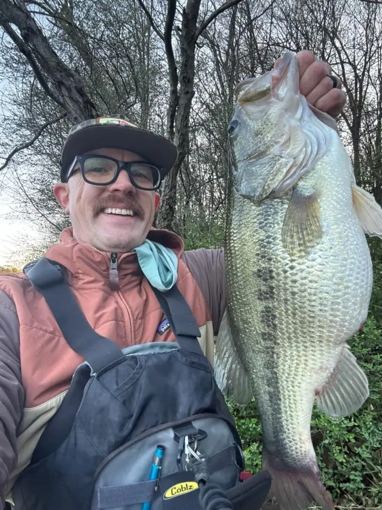 Big largemouth bass landed on a custom rat wake bait